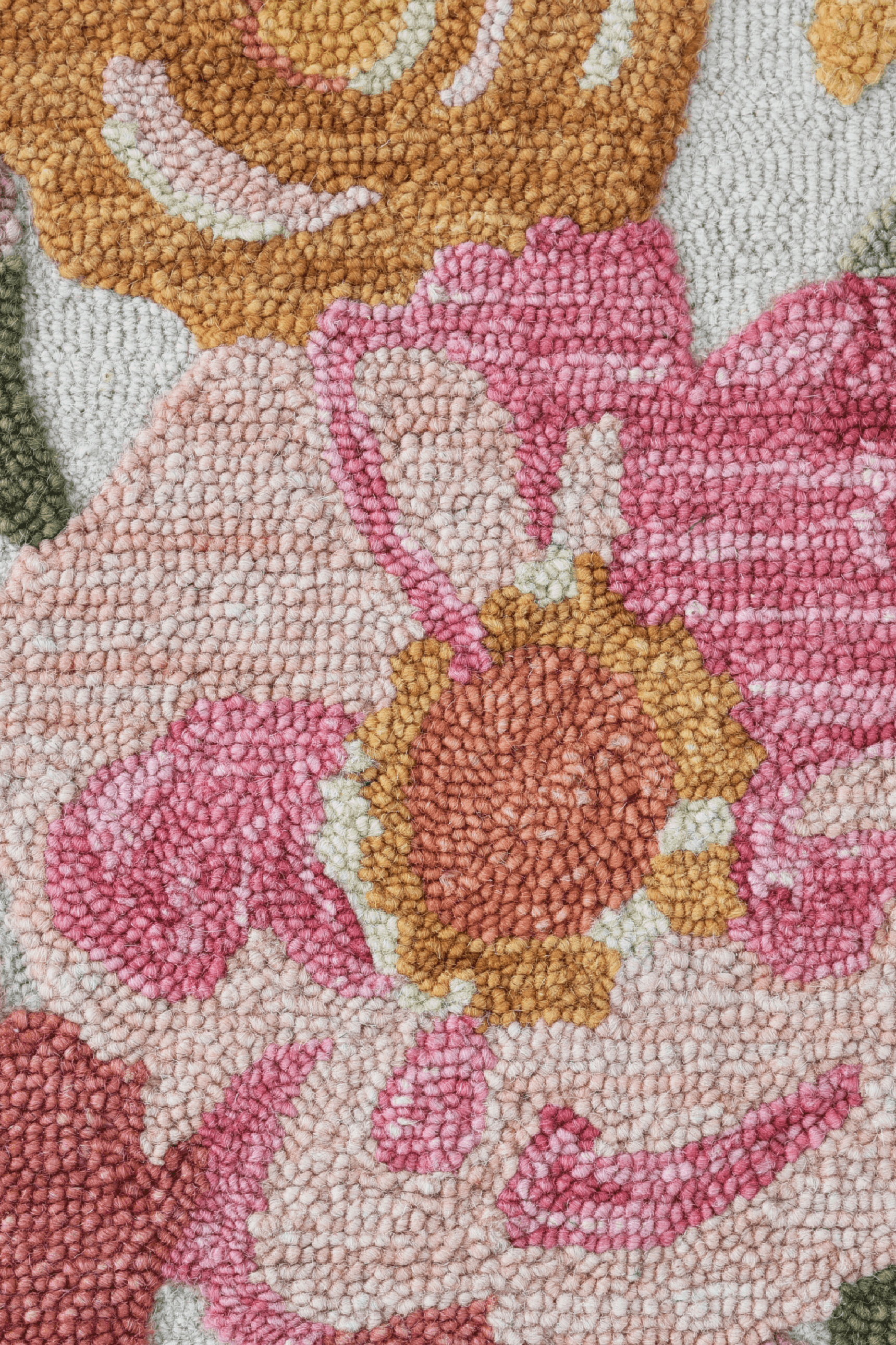 Close-up of the Petalwave Rug showcasing vibrant pink and yellow floral patterns.